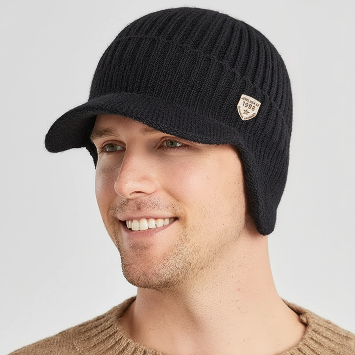 Close-up of a cozy, unisex knitted beanie with ear flaps, designed for winter outdoor adventures