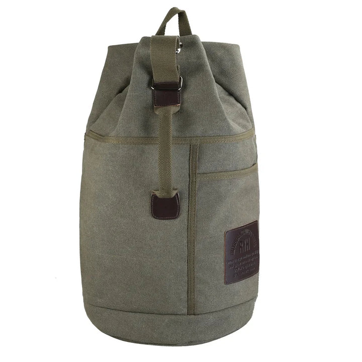 Detail of the durable canvas material on a large capacity travel backpack, suitable for all genders.