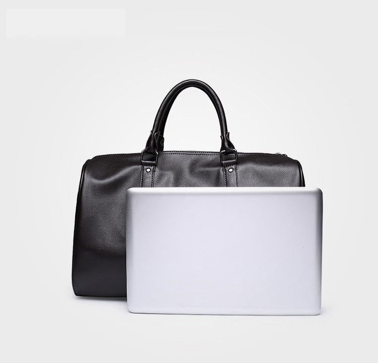 Stylish mens large travel duffel bag in PU leather, ideal lightweight carry-on luggage.