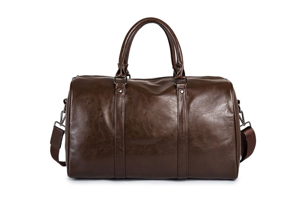 Spacious PU leather travel duffel bag, unisex, lightweight & durable for trips.
