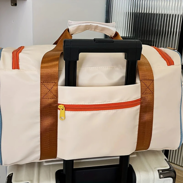 Close-up of the durable nylon fabric & unique color block pattern on the FlexaBag lightweight duffle bag.