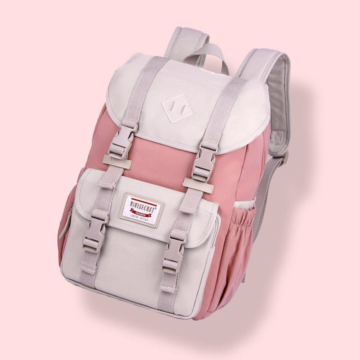Front view of a sleek unisex lightweight travel backpack with multiple zippered pockets & durable design.