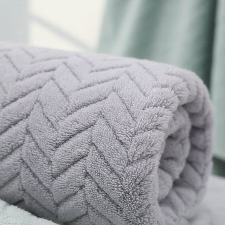 Unisex ShowerComfort bath towel set hanging, demonstrating its fluffy, soft and quick-drying properties.