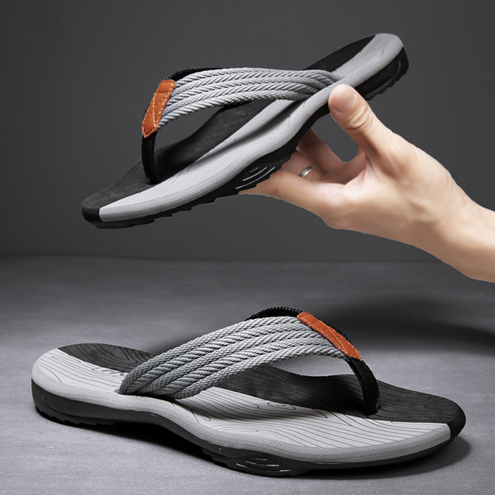 Summer-ready unisex flip flops, featuring a non-slip sole & arch support for active casual wear.