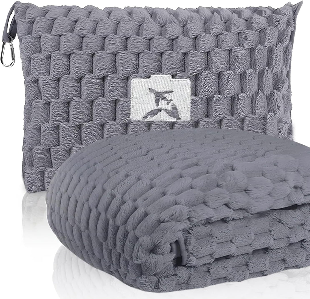 Detail of the durable stitching and quality material of the Trevora travel blanket