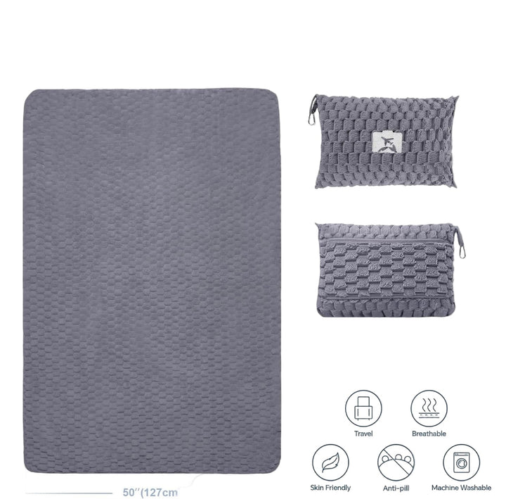 Man relaxing with packable flannel travel blanket and pillow during a car trip