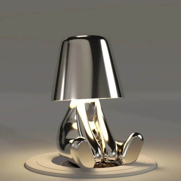 Playful Artist Lamp as a centerpiece on a dining table, decorative LED lighting