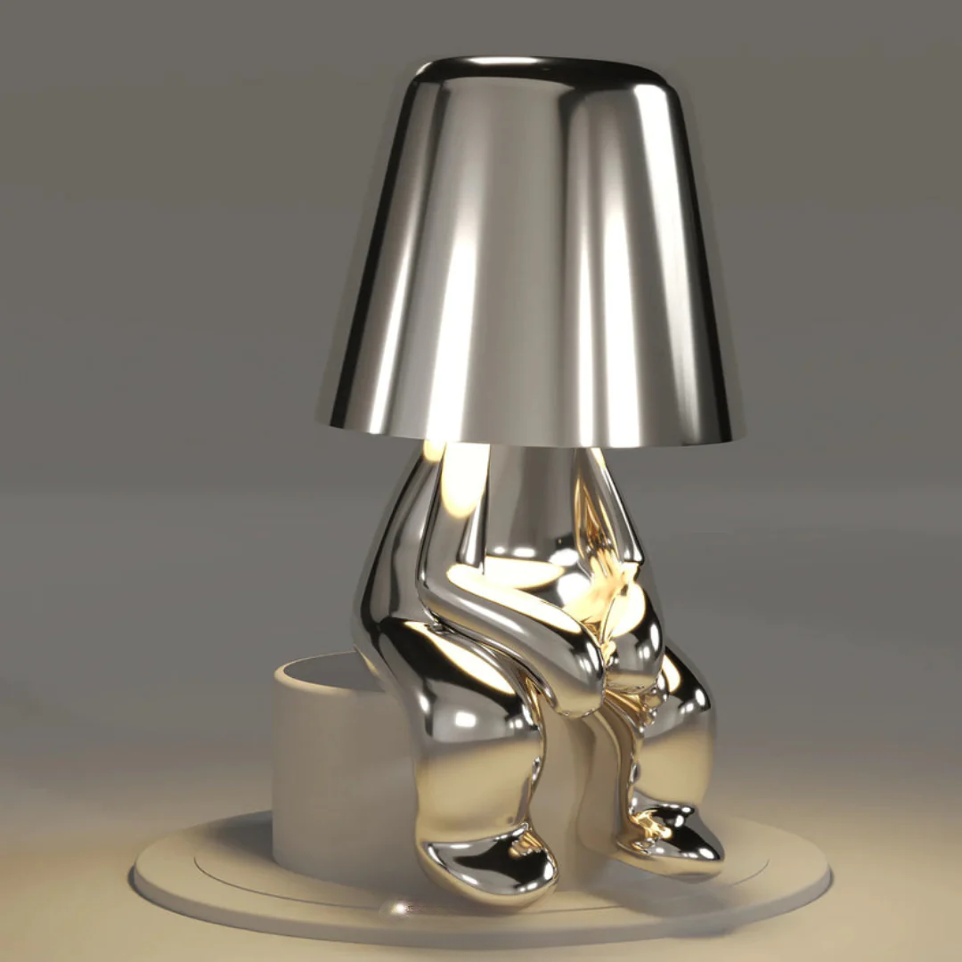 Angle view of Playful Artist Table Lamp, showing off its unique and fun design, LED light