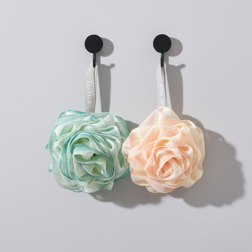 Gentle exfoliating bath flower sponge in a charming rose design, suitable for daily shower use