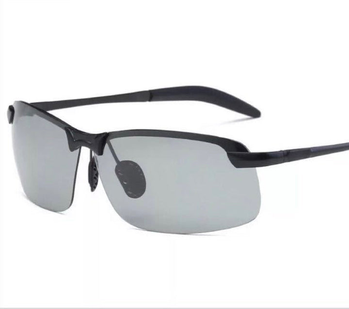 Unisex self-tinting polarized glasses, anti-glare for day & night driving. UV protection, adaptive lenses.