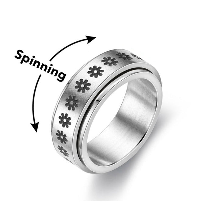 Detail shot of a silver spinning anxiety ring. Smooth action for focus, stress relief & mindful moments.