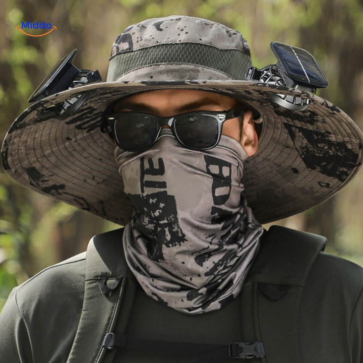 Person wearing a white solar-powered cooling fan hat, enjoying sun protection outdoors.