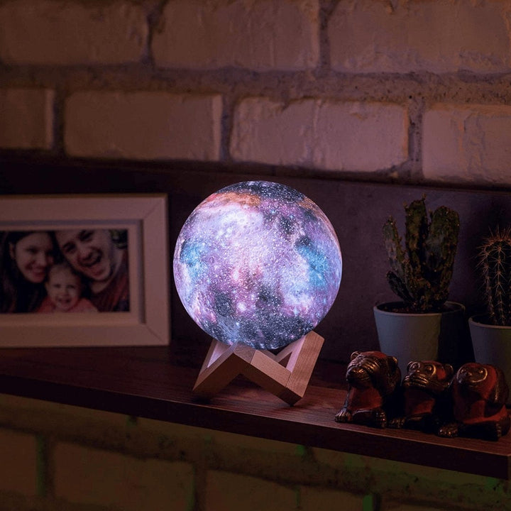 Hands holding a portable Star Design Night Lamp, highlighting its compact size, ideal starlight projector.