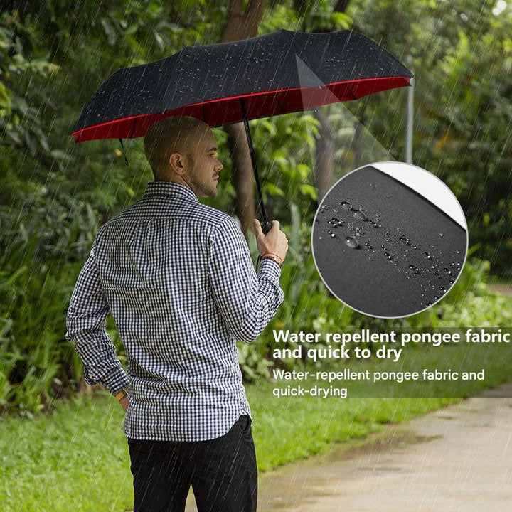 Unisex storm-proof folding umbrella, held in hand, conveying ease of use and portable rain protection