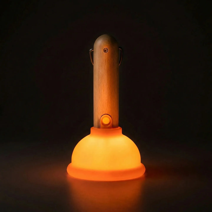 Plungeo LED table lamp with tactile plunger design, offering color-changing mood lighting