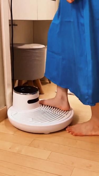 Ionized air body dryer, ShowerGust brand, showing its compact plastic form for any bathroom interior