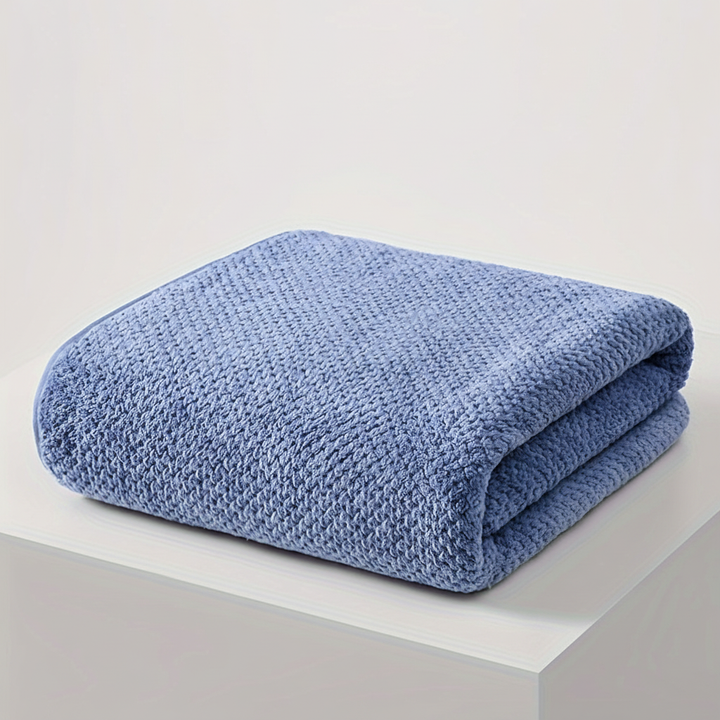 Oversized soft microfiber towel folded neatly, ideal for a spa-like bathroom experience