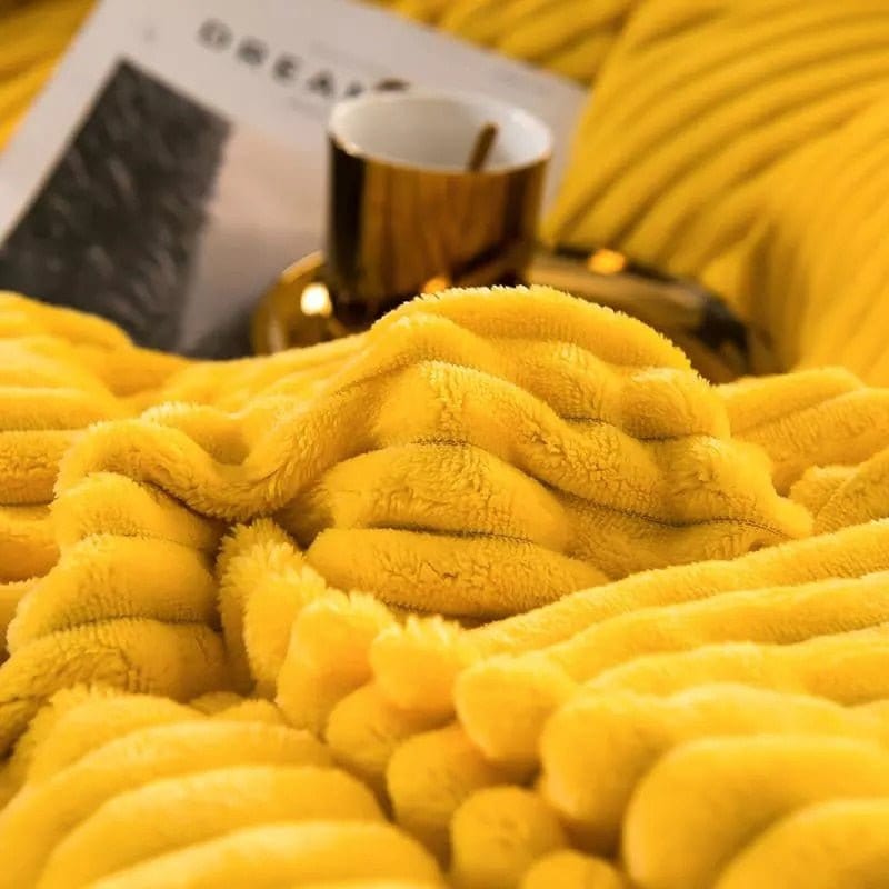 Stylish unisex winter duvet, a thick fleece blanket enhancing bedroom decor with warmth.
