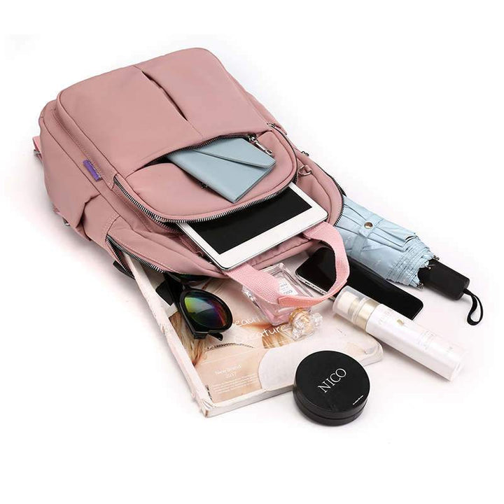Interior view of multi-compartment unisex backpack, organized for travel