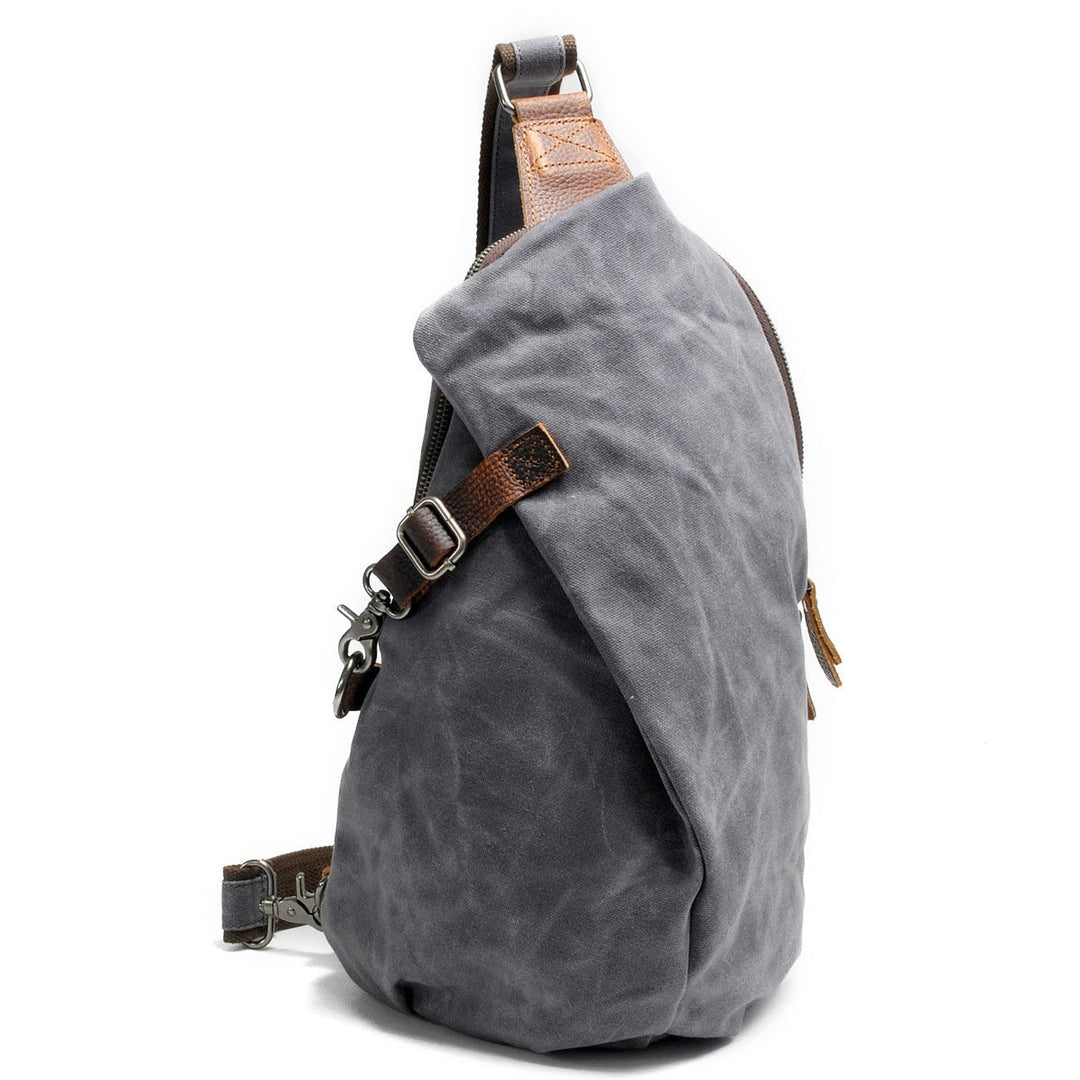 Person accessing secure anti-theft pocket on water-resistant travel crossbody bag, hands-on view
