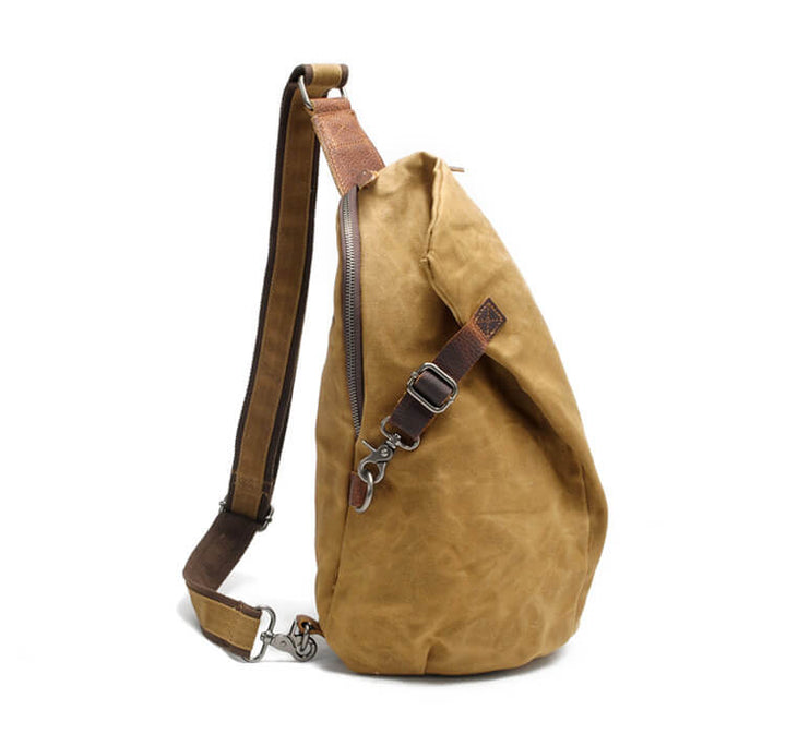 Model wearing a black water-resistant crossbody bag, convenient anti-theft back pocket, on city street