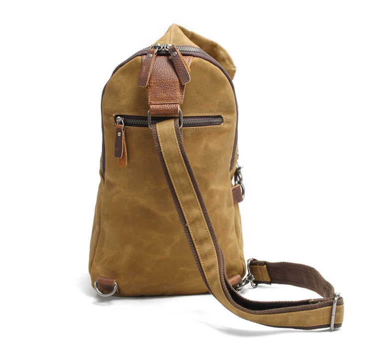 Detail of adjustable strap on unisex water-resistant canvas sling bag, comfortable and durable
