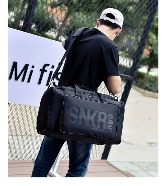Side profile of the water-resistant gym bag, demonstrating its ergonomic design and storage.
