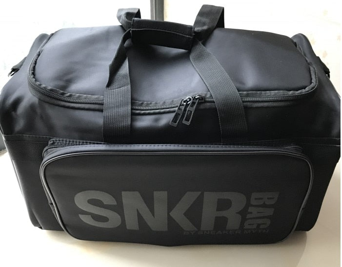Person carrying a water-resistant sneaker duffle bag over shoulder, showing portability.