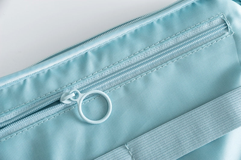 Compact electronics travel organizer, front view of the waterproof exterior