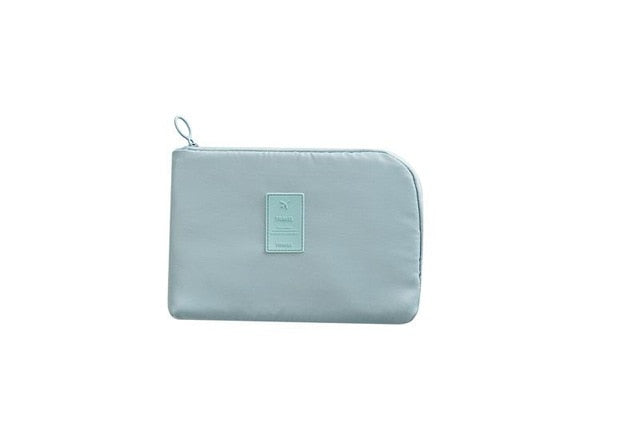 Compact waterproof electronics bag showing multiple compartments for cable management