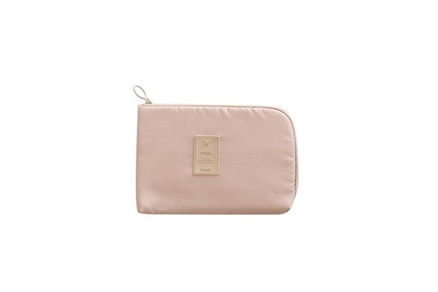 Unisex travel organizer for electronics, showcasing durable waterproof material
