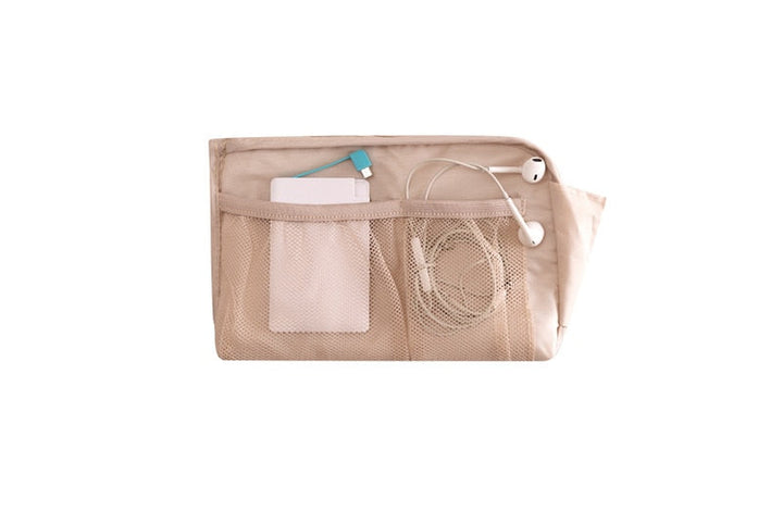 Electronics and cable management bag, open with a smartphone and earbuds stored