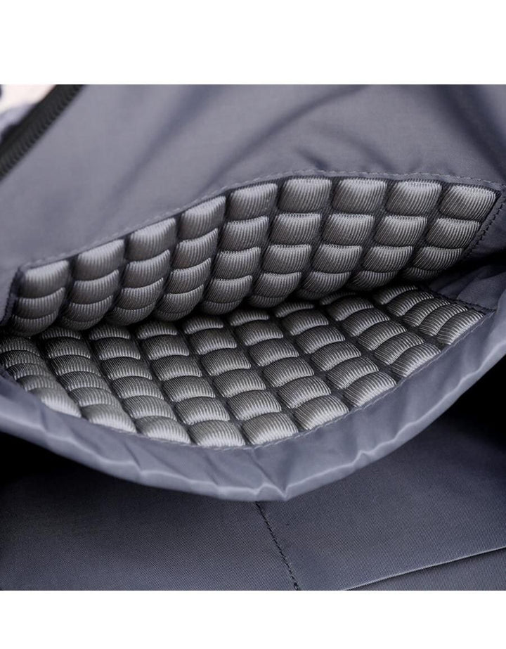 Close-up of the waterproof fabric on the sleek unisex laptop backpack.