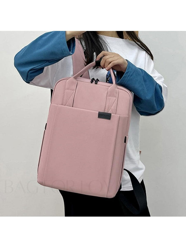 Front view of the sleek black waterproof laptop backpack, a versatile commuter bag.