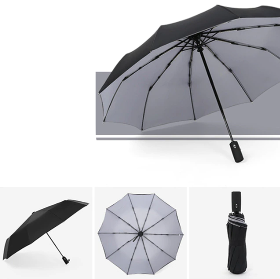 Detailed view of the ergonomic handle of the AeroShield compact foldable umbrella for comfortable grip