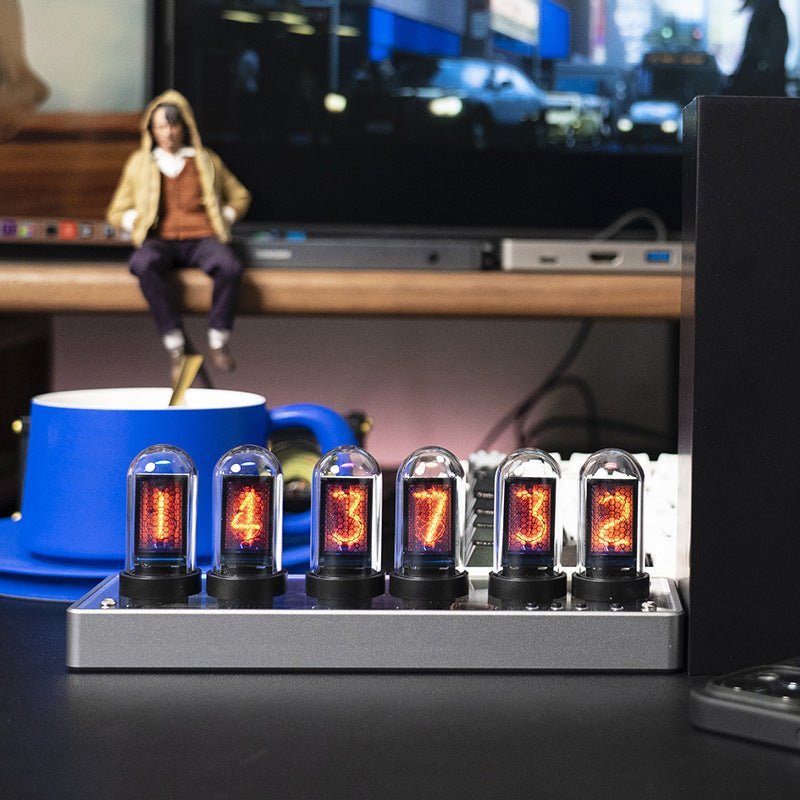 Minimalist vertical LED Nixie style clock on a modern desk, adding a unique retro-futuristic touch to home decor.