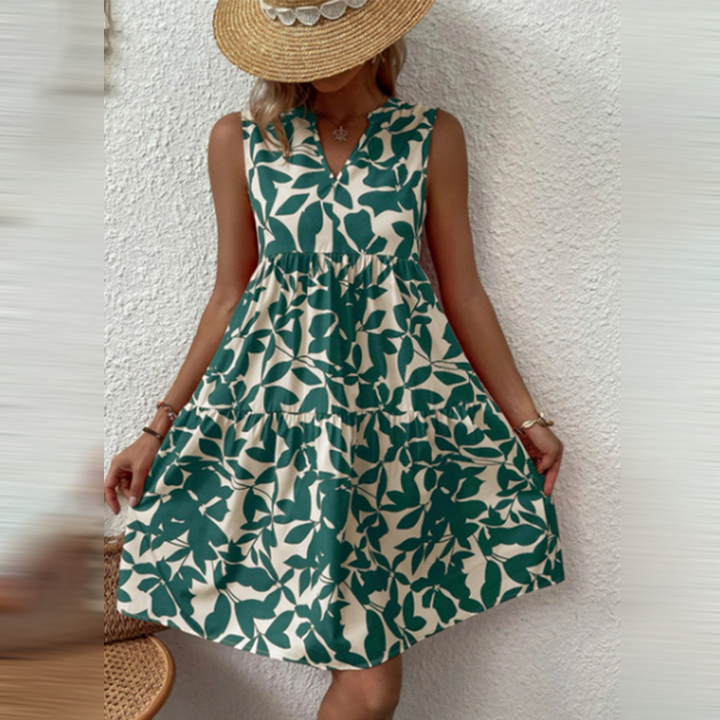 Flowy women's boho summer dress with a vibrant print and deep V-neck, ideal for vacation or festival fashion.
