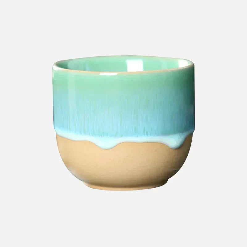 Vibrant ceramic tea cup, a colorful gift idea with an artistic splatter pattern.