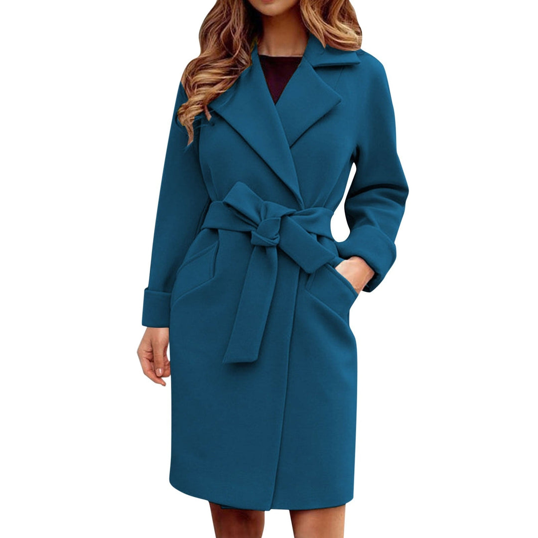 Elegant ladies' winter trench coat with a long cut and button front, offering warmth and a chic outerwear look.
