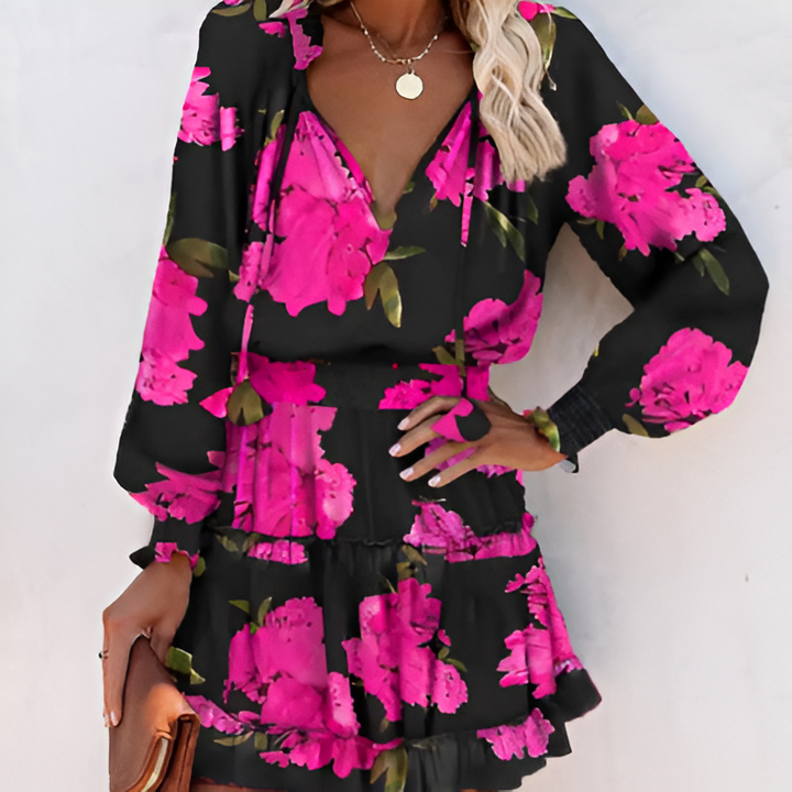 Flowy women's summer midi dress with a vibrant print and elegant ruffles.