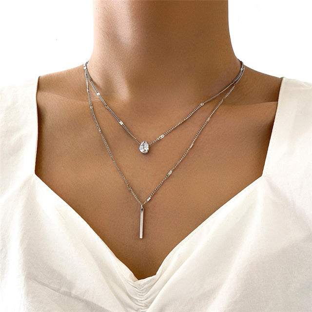 Sparkling vintage gold & silver pendant necklaces. Women's elegant fashion jewelry accessory.