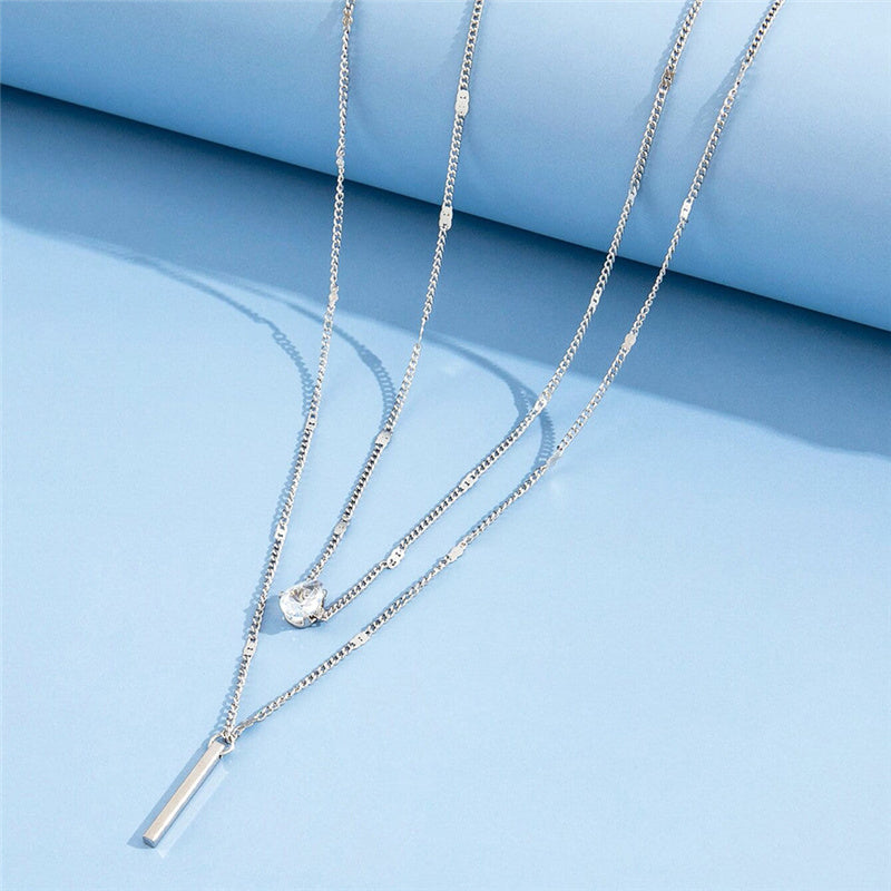 Two-piece vintage pendant necklace set in gold & silver. Women's classic jewelry for fashion.