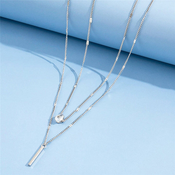 Two-piece vintage pendant necklace set in gold & silver. Women's classic jewelry for fashion.