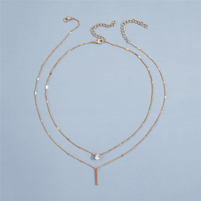 Sparkling gold & silver vintage pendant necklace set. Women's elegant jewelry accessory for any look.