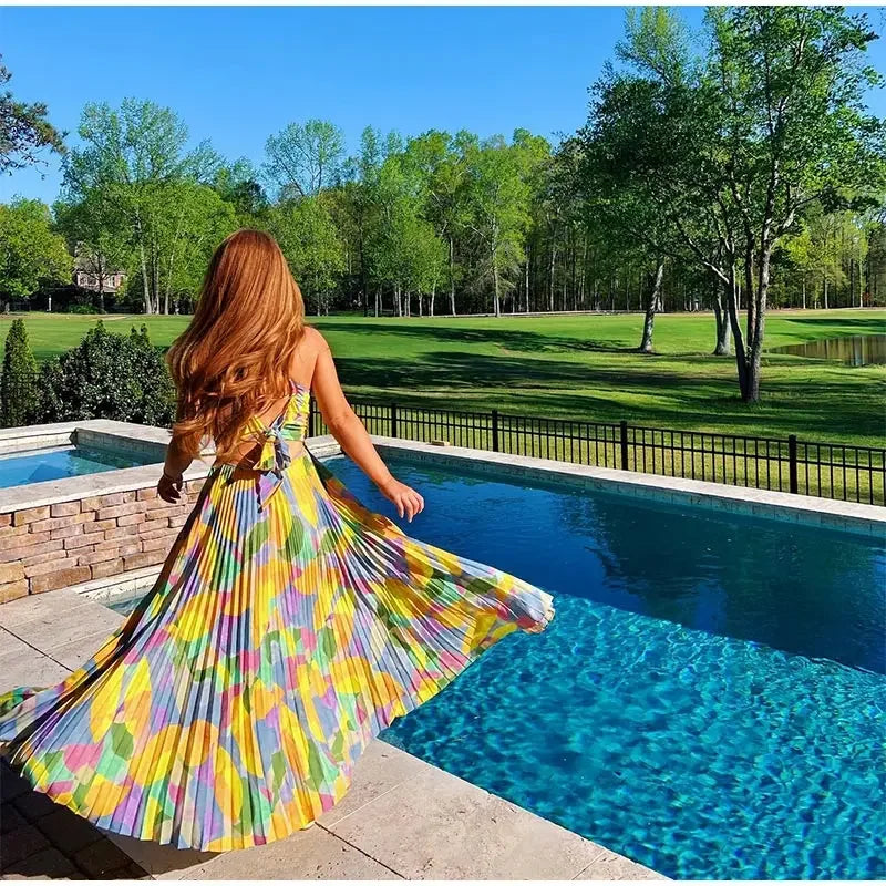 Sleeveless floral print summer dress for women, featuring a deep v-neck and elegant bow at the back.