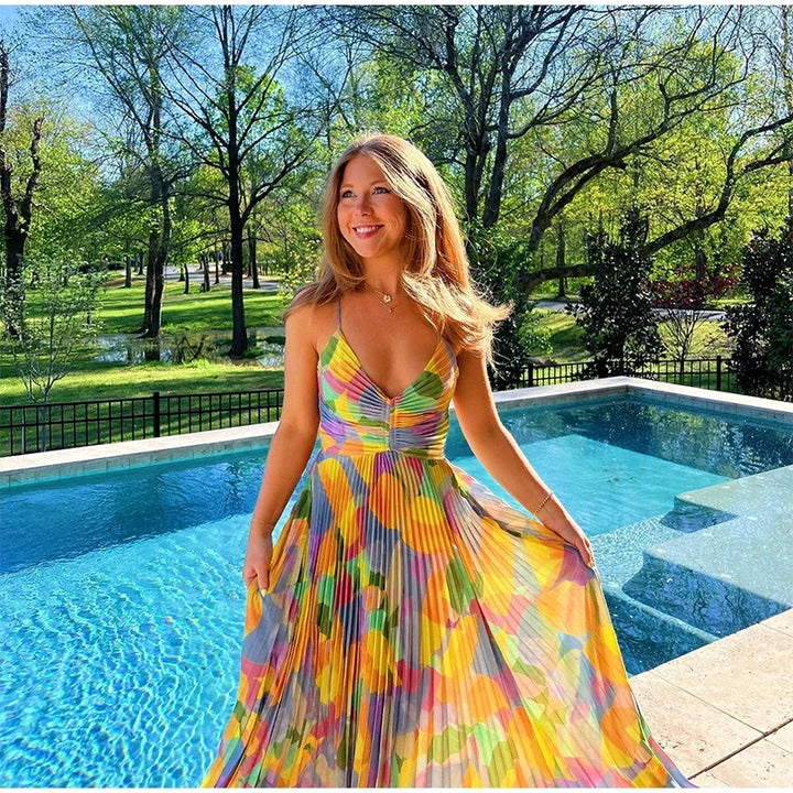 Casual women's floral midi dress with deep V-neckline and delicate bow detail, ideal for summer outings.