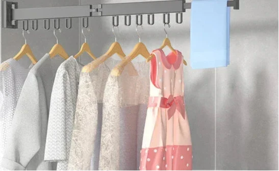 Foldable aluminum wall mounted drying rack for clothes, perfect for small spaces & laundry.