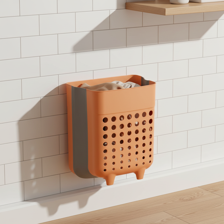 Wall-mounted foldable laundry basket, space-saving hamper for bathroom storage and home organization.