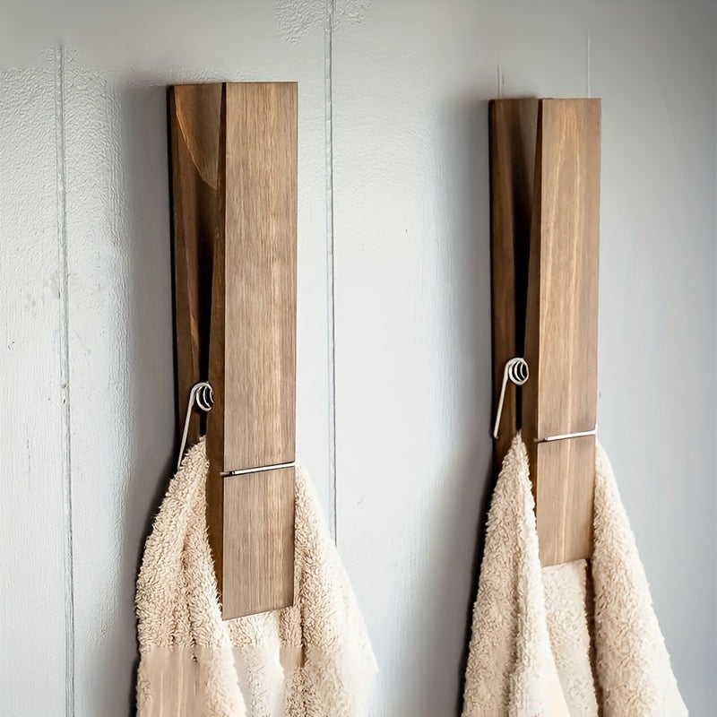 Stylish wall-mounted wooden towel holder, perfect for bathroom or laundry room decor