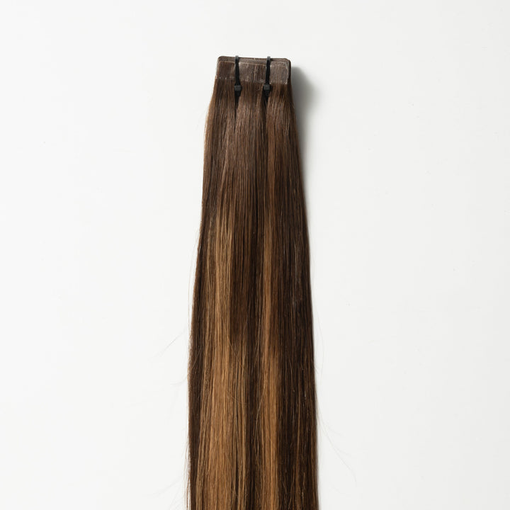 Reusable Warm Brown Balayage human hair tape-in extensions for women, offering natural volume & length.